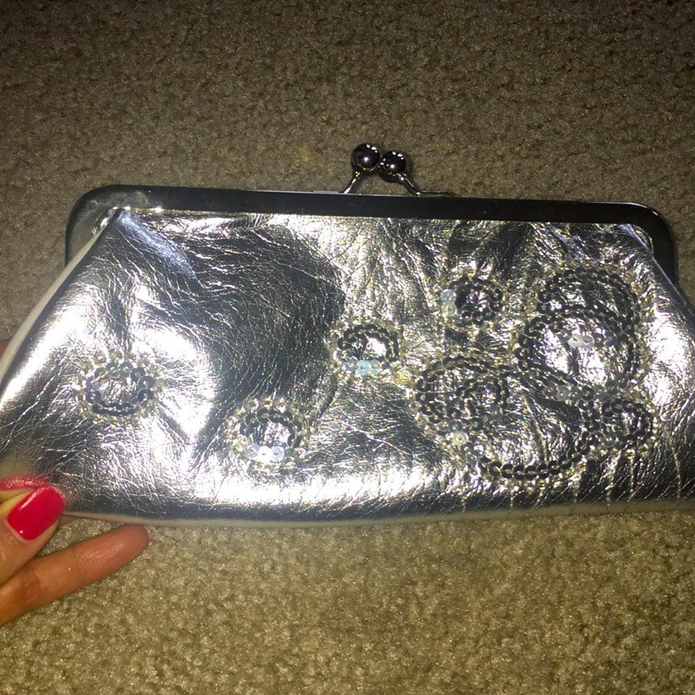 SMALL CLUTCH SILVER COLOR GOOD CONDITION